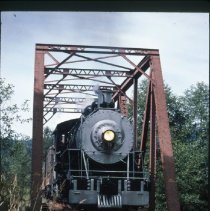 Blue Goose crossing railroad bridge