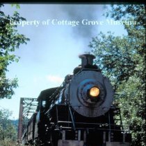Blue Goose crossing railroad bridge
