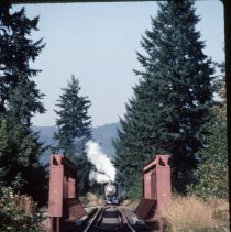 Blue Goose approaching railroad bridge