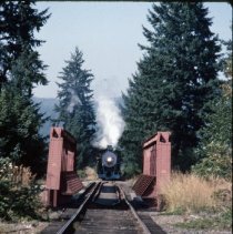 Blue Goose approaching railroad bridge