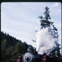Blue Goose crossing railroad bridge