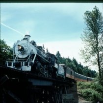 Blue Goose crossing river on trestle
