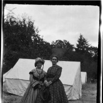 Portrait of two women actors in costume on set
