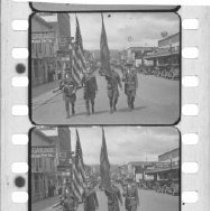 Soldiers leading a parade on Main Street
