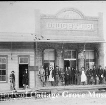 People posed in front of Currin Drug Store
