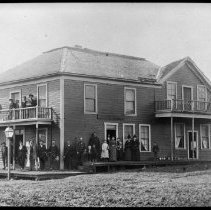 People posed on the porch of the "Central Hotel"