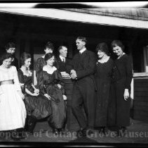 Group of unidentifed people on a porch
