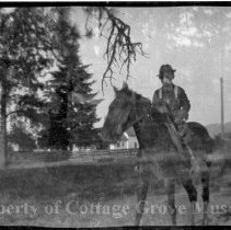 Unidentified man on horse