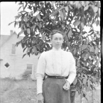 Unidentified woman posed outside