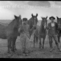 Unidentified man and boy with horses