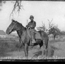 Unidentified person on horse