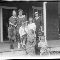 Unidentified women and children on a porch