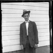 Unidentified man posed outside a building