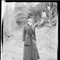 Unidentifed woman posed outside