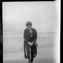 Unidentified woman posed clamming on the beach