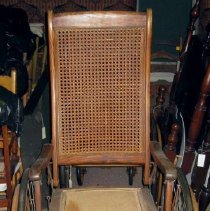 Wheelchair with cane back and leg supports