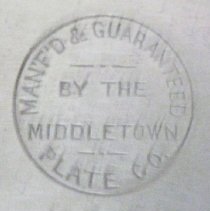 Close up of manufacturer's marks on base of silver plated tureen