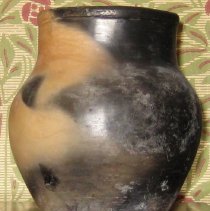 Bulbous shaped turned earthenware vase