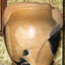Unglazed tapered bulbous earthenware vase