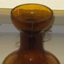 Bulbous base amber glass hyacinth holder