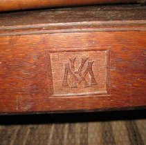 Carved initials on wool winder