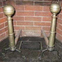 Andirons with cylindrical column topped by large brass bell