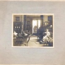 Woman seatedin a parlor