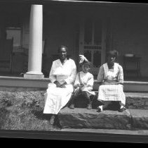Negative of an African American woman and two girls at Pennypacker Mills