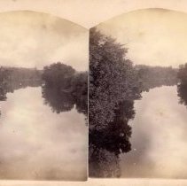 Stereograph of view down the Perkiomen Creek from bridge