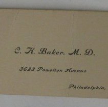 Business card in inside pocket of man's black vest