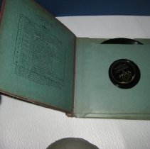 Brown record album "His Master's Voice" opened to show index and sleeves