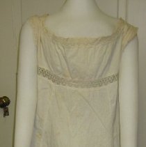 Sleeveless white cotton slip with eyelet lace