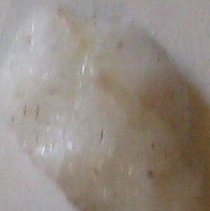 Quartz arrowhead with broken tip