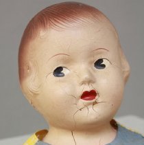 close up of crack on doll face