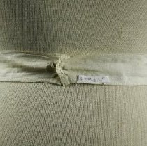 Lawn apron button fastening