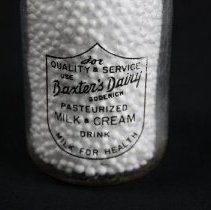 Glass cream bottle, label