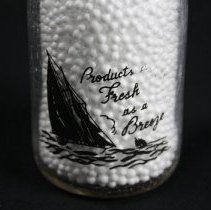 Glass cream bottle, label on back