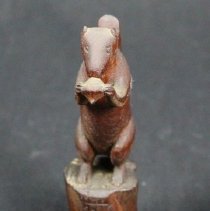 front view of squirrel carving