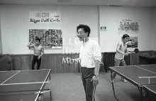 Thavisit Sayasane supervises ping pong at YWCA