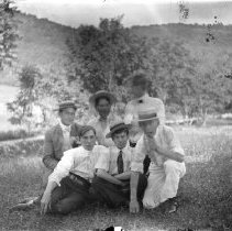 Men and Woman Kneeling and Sitting on Ground