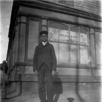 Outdoor Informal Portrait of Boy In front of Store