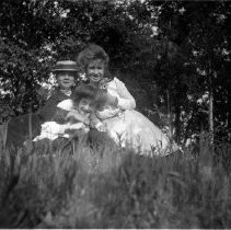 3 People Sitting in the Grass