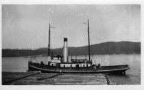 Steam tug Wallowa (1889) alongside logboom.