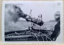 Smoke generator on stern of tug during 1952 Seattle Tug Races. Karl House p