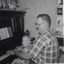 Eugene Owen & an infant (ca. 1964)