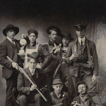 Eight young men holding objects (ca. 1900-1919)