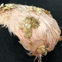 Pink feathered pill-box hat.