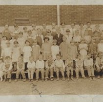 First grade students & teacher at a school (ca. 1920-1930)