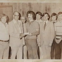 Several men at check presentation (ca. 1970-1980)
