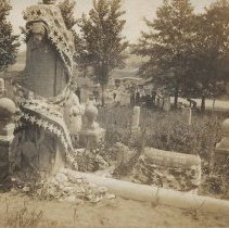 Unidentified people decorating graves (ca. 1900-1915)